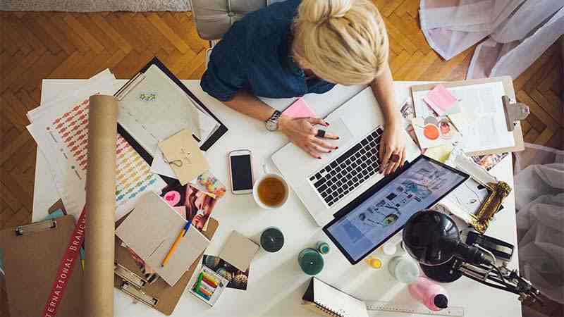 woman working at desk with laptop